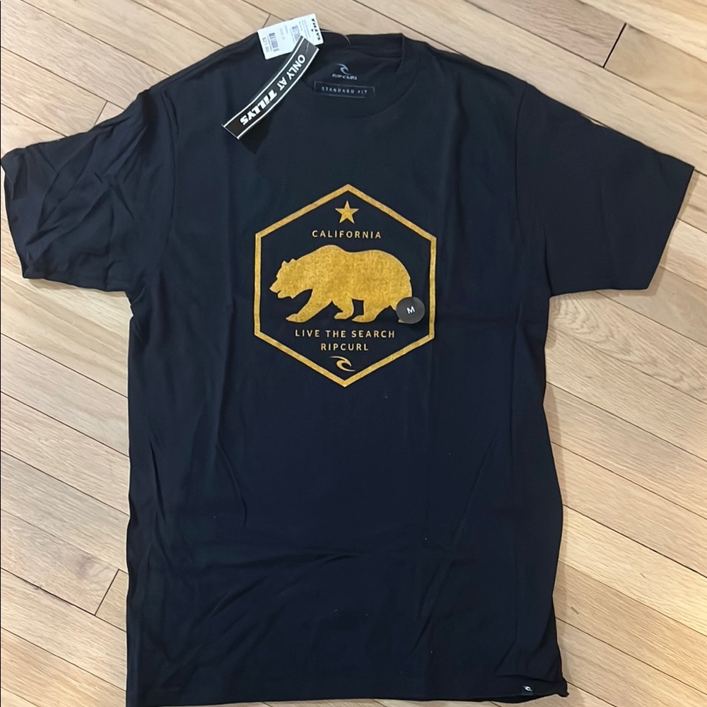New with tags Rip Curl Black T-Shirt with Gold Graphic